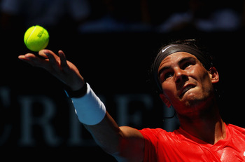 MELBOURNE, AUSTRALIA - JANUARY 20:  Rafael Nadal of Spain serves in his second round match against Ryan Sweeting of the United States of America during day four of the 2011 Australian Open at Melbourne Park on January 20, 2011 in Melbourne, Australia.  (P