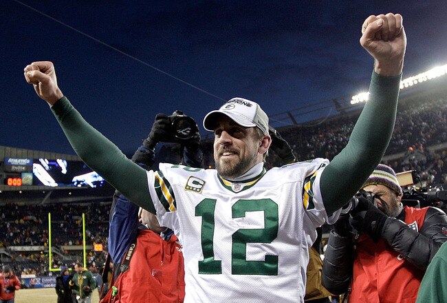 CHICAGO, IL - JANUARY 23:  Quarterback Aaron Rodgers #12 of the Green Bay Packers celebrates the Packers 21-14 victory against the Chicago Bears in the NFC Championship Game at Soldier Field on January 23, 2011 in Chicago, Illinois.  (Photo by Jamie Squir