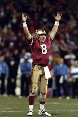 14 Dec 1998: Steve Young #8 of the San Francisco 49ers signals a touchdown during the game against the Detroit Lions at 3Com Park in San Francisco, California. The 49ers defeated the Lions 35-13. Mandatory Credit: Jed Jacobsohn  /Allsport