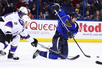 ST. LOUIS, MO - JANUARY 18: Brad Winchester #15 of the St. Louis Blues passes the puck against the Los Angeles Kings at the Scottrade Center on January 18, 2011 in St. Louis, Missouri.  (Photo by Dilip Vishwanat/Getty Images)