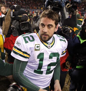 CHICAGO, IL - JANUARY 23:  Quarterback Aaron Rodgers #12 of the Green Bay Packers stands by Jay Cutler #6 of the Chicago Bears after the Packers 21-14 victory against the Bears in the NFC Championship Game at Soldier Field on January 23, 2011 in Chicago,