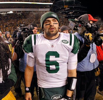 PITTSBURGH, PA - JANUARY 23:  Mark Sanchez #6 of the New York Jets leaves the field as Troy Polamalu #43 of the Pittsburgh Steelers looks on after the Pittsburgh Steelers defeated the New York Jets 24 to 19 in their 2011 AFC Championship game at Heinz Fie