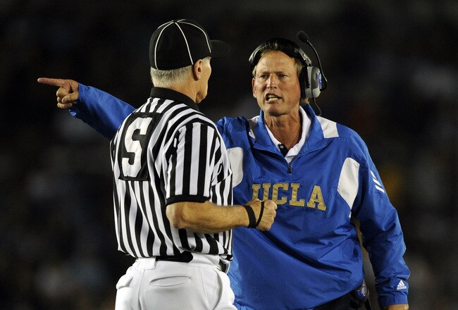 PASADENA, CA - SEPTEMBER 11:  Head Coach Rick Neuheisel of UCLA yells at the referee during the second quarter against Stanford at the Rose Bowl on September 11, 2010 in Pasadena, California.  (Photo by Harry How/Getty Images)