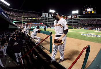 ARLINGTON, TX - OCTOBER 30:  Starting pitcher Jonathan Sanchez #57 of the San Francisco Giants walks into the dugout dejected after he was taken out of the game in the bottom of the fifth inning against the Texas Rangers in Game Three of the 2010 MLB Worl