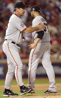 ARLINGTON, TX - OCTOBER 30:  Manager Bruce Bochy (L) of the San Francisco Giants takes starting pitcher Jonathan Sanchez #57 out of the game in the bottom of the fifth inning against the Texas Rangers in Game Three of the 2010 MLB World Series at Rangers