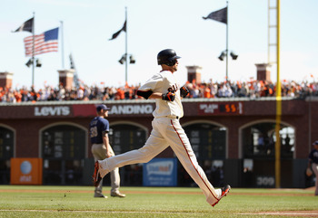 SAN FRANCISCO - OCTOBER 03:  Jonathan Sanchez #57 of the San Francisco Giants scores on a hit by Freddy Sanchez to give the Giants a 1-0 lead in their game against the San Diego Padres at AT&T Park on October 3, 2010 in San Francisco, California.  (Photo