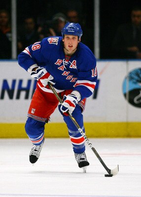 NEW YORK , NY - JANUARY 13: Marc Staal #18 of the New York Rangers plays the puck against the Vancouver Canucks during the game at Madison Square Garden on January 13, 2011 in New York City. (Photo by Andy Marlin/Getty Images)