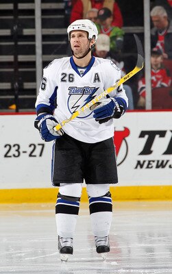 NEWARK, NJ - JANUARY 09:  Martin St. Louis #26 of the Tampa Bay Lightning looks up during a break in an NHL hockey game against the New Jersey Devils at the Prudential Center on January 9, 2011 in Newark, New Jersey.  (Photo by Paul Bereswill/Getty Images
