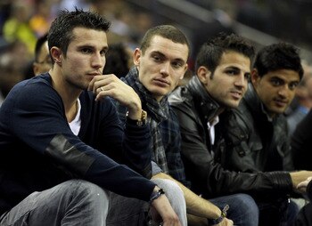LONDON, ENGLAND - OCTOBER 04:  Arsenal footballers (L-R) Robin van Persie, Thomas Vermaelen, Francesc Fabregas and Carlos Vela during the NBA Europe Live match between the Los Angeles Lakers and the Minnesota Timberwolves at the O2 arena on October 4, 201