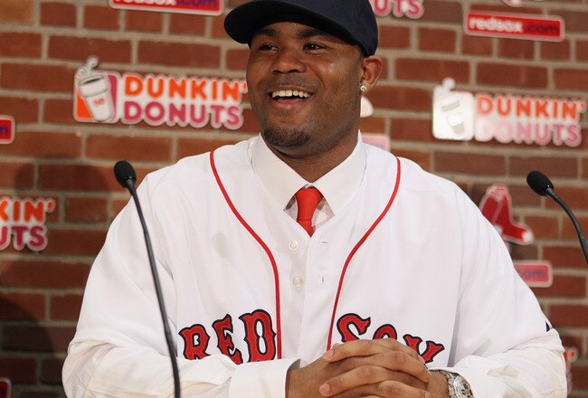 BOSTON, MA - DECEMBER 11:  Carl Crawford answers questions during a press conference announcing his signing with the Boston Red Sox on December 11,  2010 at the Fenway Park in Boston, Massachusetts.  (Photo by Elsa/Getty Images)