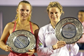 HUA HIN, THAILAND - JANUARY 01:    Caroline Wozniacki of Denmark and Kim Clijsters of Belgium hold the trophy after their exhibition match at Centenial Park on January 1, 2011 in Hua Hin, Thailand.  (Photo by Athit Perawongmetha/Getty Images)