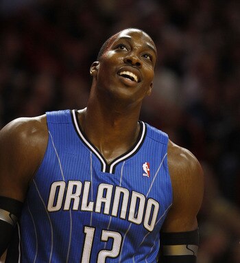 MIAMI - OCTOBER 29:  Center Dwight Howard #12  of the Orlando Magic dunks against the Miami Heat at American Airlines Arena on October 29, 2010 in Miami, Florida.  NOTE TO USER: User expressly acknowledges and agrees that, by downloading and or using this