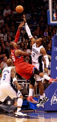 ORLANDO, FL - DECEMBER 18:  Dwight Howard #12 of the Orlando Magic attempts to block the shot of Marreese Speights #16 of the Philadelphia 76ers during the game at Amway Arena on December 18, 2010 in Orlando, Florida.  NOTE TO USER: User expressly acknowl