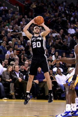 OAKLAND, CA - JANUARY 24:  Manu Ginobili #20 of the San Antonio Spurs in action against the Golden State Warriors at Oracle Arena on January 24, 2011 in Oakland, California.  NOTE TO USER: User expressly acknowledges and agrees that, by downloading and or