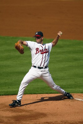 ATLANTA - OCTOBER 2:  Starting pitcher Tom Glavine #47 of the Atlanta Braves delivers a pitch in Game one of the National League Divisional Series against the San Francisco Giants at Turner Field on October 2, 2002 in Atlanta, Georgia. The Giants won 8-5.