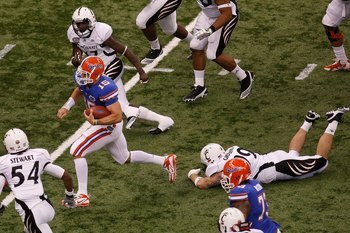 NEW ORLEANS - JANUARY 01:  Tim Tebow #15 of the Florida Gators runs through the defense of the Cincinnati Bearcats during the Allstate Sugar Bowl at the Louisana Superdome on January 1, 2010 in New Orleans, Louisiana.  (Photo by Chris Graythen/Getty Image