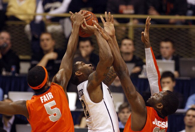 PITTSBURGH, PA - JANUARY 17:  Brad Wanamaker #22 of the Pittsburgh Panthers battles to the basket against C.J. Fair #5 and Rick Jackson #0 of the Syracuse Orange at Petersen Events Center on January 17, 2011 in Pittsburgh, Pennsylvania.  The Panthers defe