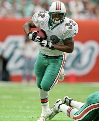 5 Dec 1999:  J. J. Johnson #32 of the Miami Dolphins carries the ball during the game against the Indianapolis Colts at the Pro Player Stadium in Miami, Florida. The Colts defeated the Dolphins 37-34. Mandatory Credit: Andy Lyons  /Allsport