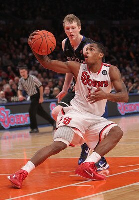 NEW YORK, NY - JANUARY 30: Dwight Hardy #12 of the St. John's Red Storm fakes in front of Kyle Singler #12 of the Duke Blue Devils  at Madison Square Garden on January 30, 2011 in New York City.  (Photo by Nick Laham/Getty Images)