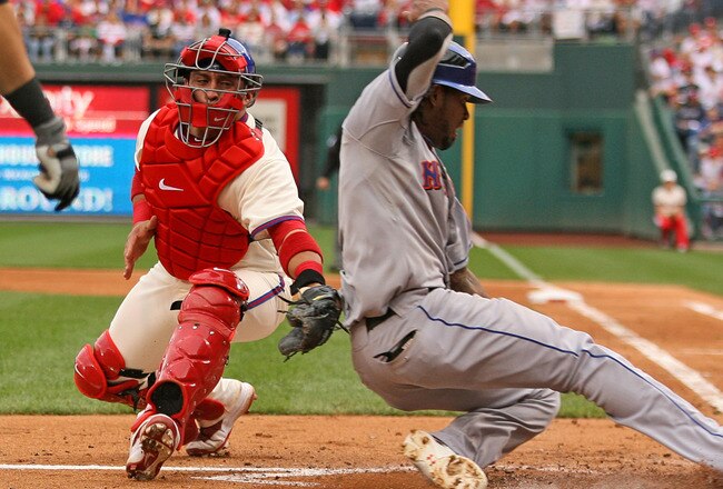 PHILADELPHIA - SEPTEMBER 26: Catcher Carlos Ruiz #51 of the Philadelphia Phillies tags out shortstop Jose Reyes #7 of the New York Mets at home plate during a game at Citizens Bank Park on September 26, 2010 in Philadelphia, Pennsylvania. (Photo by Hunter