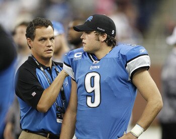 DETROIT - NOVEMBER 07: Detroit Lions team doctor Kyle Anderson checks the right shoulder of Matthew Stafford #9 of the Detroit Lions after leaving the game during the third quarter of the game at Ford Field on November 7, 2010 in Detroit, Michigan. The Je