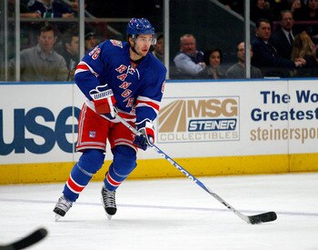 NEW YORK , NY - JANUARY 13: Wojtek Wolski #86 of the New York Rangers plays the puck against the Vancouver Canucks during the game at Madison Square Garden on January 13, 2011 in New York City.  (Photo by Andy Marlin/Getty Images)