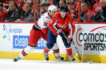WASHINGTON - NOVEMBER 28:  Nicklas Backstrom #19 of the Washington Capitals controls the puck against Brandon Sutter #16 of the Carolina Hurricanes at the Verizon Center on November 28, 2010 in Washington, DC.  (Photo by Greg Fiume/Getty Images)