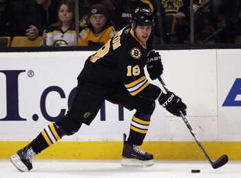 BOSTON, MA - NOVEMBER 26:  Nathan Horton #18 of the Boston Bruins takes the puck against the Carolina Hurricanes on November 26, 2010 at the TD Garden in Boston, Massachusetts.  (Photo by Elsa/Getty Images)