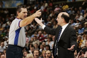 DENVER - APRIL 17:  Head coach Jeff Van Gundy of the Houston Rockets petitions referee Greg Williard #57 for the shot clock to be reset in the final minute against the Denver Nuggets on April 17, 2006 at the Pepsi Center in Denver, Colorado. The Rockets w