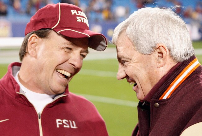 CHARLOTTE, NC - DECEMBER 04:  Head coach Jimbo Fisher of the Florida State Seminoles talks with head coach Frank Beamer of the Virginia Tech Hokies during their game at Bank of America Stadium on December 4, 2010 in Charlotte, North Carolina.  (Photo by S