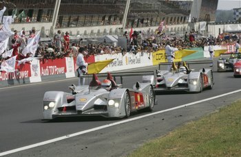 LE MANS, FRANCE - JUNE 18: Emanuele Pirro and Allan McNish finish 1st and 3rd after 24 hours of racing at the end of the Le Mans 24H Race at the Le Mans Sarthe Circuit on June 18, 2006 in Le Mans, France. (Photo by John Marsh/Getty Images)