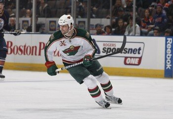 EDMONTON, CANADA - JANUARY 18: John Madden #11 of the Minnesota Wild skates against the Edmonton Oilers on January 18, 2011 at Rexall Place in Edmonton, Alberta, Canada. (Photo by Dale MacMillan/Getty Images)