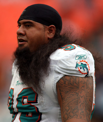 MIAMI - DECEMBER 19:  Defensive tackle Paul Soliai #96 of the Miami Dolphins walks off the field against the Buffalo Bills at Sun Life Stadium on December 19, 2010 in Miami, Florida. The Bills defeated the Dolphins 17-14.  (Photo by Marc Serota/Getty Imag
