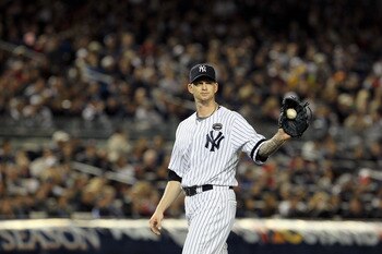 NEW YORK - OCTOBER 19:  A.J. Burnett #34 of the New York Yankees looks on against the Texas Rangers in Game Four of the ALCS during the 2010 MLB Playoffs at Yankee Stadium on October 19, 2010 in the Bronx borough of New York City.  (Photo by Jim McIsaac/G