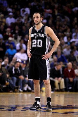 OAKLAND, CA - JANUARY 24:  Manu Ginobili #20 of the San Antonio Spurs in action against the Golden State Warriors at Oracle Arena on January 24, 2011 in Oakland, California.  NOTE TO USER: User expressly acknowledges and agrees that, by downloading and or