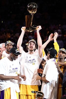 LOS ANGELES, CA - JUNE 17:  Pau Gasol #16 of the Los Angeles Lakers holds up the Larry O'Brien trophy after the Lakers defeated the Boston Celtics in Game Seven of the 2010 NBA Finals at Staples Center on June 17, 2010 in Los Angeles, California.  NOTE TO
