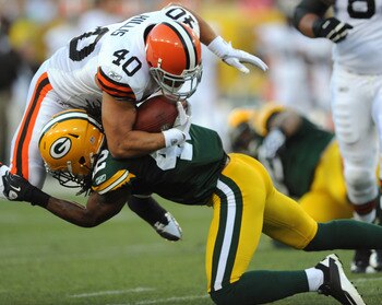 GREEN BAY - AUGUST 14: Peyton Hillis #40 of the Cleveland Browns is tackled by Morgan Burnett #42 of the Green Bay Packers during the NFL preseason game at Lambeau Field August 14, 2010 in Green Bay, Wisconsin.  (Photo by Tom Dahlin/Getty Images)