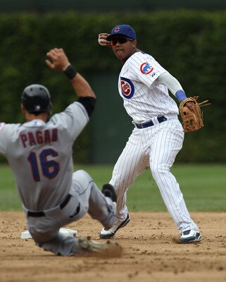 CHICAGO - SEPTEMBER 05: Starlin Castro #13 of the Chicago Cubs turns a double play as Angel Pagan #16 of the New York Mets slides into 2nd base at Wrigley Field on September 5, 2010 in Chicago, Illinois. (Photo by Jonathan Daniel/Getty Images)