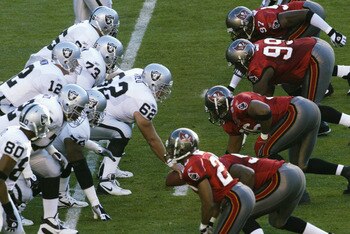SAN DIEGO - JANUARY 26:  Center Adam Treu #62 of the Oakland Raiders (starting for Barret Robbins) readies to hike the ball as the offense lines up against the Tampa Bay Buccaneers defense during Super Bowl XXXVII on January 26, 2003 at Qualcomm Stadium i