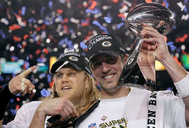 ARLINGTON, TX - FEBRUARY 06:  Aaron Rodgers #12 and Clay Matthews #52 of the Green Bay Packers of the Green Bay Packers holds the Lombardi Trophy after defeating the Pittsburgh Steelers 31-25 during Super Bowl XLV at Cowboys Stadium on February 6, 2011 in