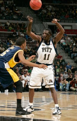 AUBURN HILLS, MI - MARCH 17: Carl Krauser #11 of the Pittsburgh Panthers passes against the defense of the Kent State Flashes during the First Round of the 2006 NCAA Men's Basketball Tournament at The Palace of Auburn Hills on March 17, 2006 in Auburn Hil