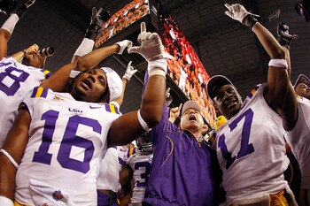 ARLINGTON, TX - JANUARY 07:  Head coach Les Miles of the Louisiana State University Tigers celebrates after defeating the Texas A&M Aggies 41-24 during the AT&T Cotton Bowl at Cowboys Stadium on January 7, 2011 in Arlington, Texas.  (Photo by Chris Grayth