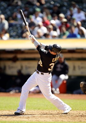 OAKLAND, CA - SEPTEMBER 22:  Jack Cust #32 of the Oakland Athletics hits a single to score Cliff Pennington and give the Athletics a 2-0 lead in the sixth inning against the Chicago White Sox at the Oakland-Alameda County Coliseum on September 22, 2010 in