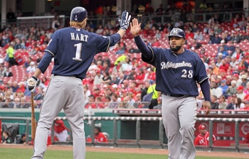 CINCINNATI - MAY 18: Prince Fielder #28 of the Milwaukee Brewers is congratulated by Corey Hart #1 after Fielder scored in the first inning during the game against the Cincinnati Reds at Great American Ball Park on May 18, 2010 in Cincinnati, Ohio. (Pho