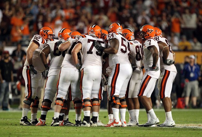 MIAMI, FL - JANUARY 03:  The Virginia Tech Hokies offense stands in the huddle against the Stanford Cardinal during the 2011 Discover Orange Bowl at Sun Life Stadium on January 3, 2011 in Miami, Florida. Stanford won 40-12. (Photo by Streeter Lecka/Getty