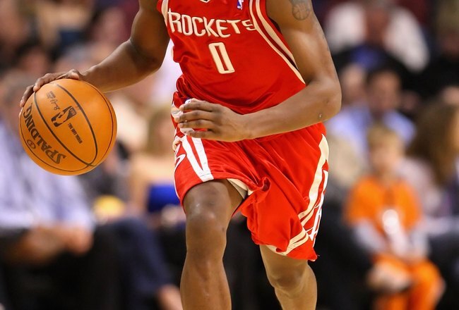PHOENIX - JANUARY 06:  Aaron Brooks #0 of the Houston Rockets handles the ball during the NBA game against the Phoenix Suns at US Airways Center on January 6, 2010 in Phoenix, Arizona. The Suns defeated the Rockets 118-110.  NOTE TO USER: User expressly a
