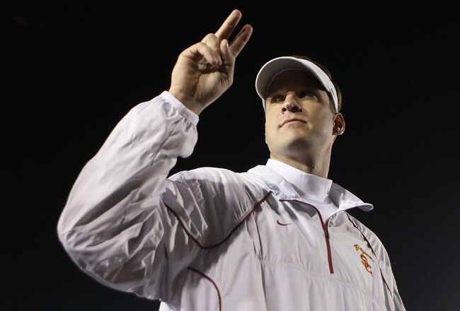 PASADENA, CA - DECEMBER 04:  USC Trojans head coach Lane Kiffin celebrates following his teams victory over the UCLA Bruins at the Rose Bowl on December 4, 2010 in Pasadena, California.  USC defeated UCLA 28-14.  (Photo by Jeff Gross/Getty Images)