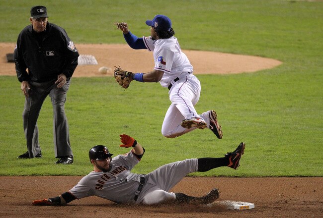 ARLINGTON, TX - OCTOBER 31:  Cody Ross #13 of the San Francisco Giants is forced out at second base off a ground ball by teammate Travis Ishikawa #10 (not pictured) who was safe at first during the second inning against the Texas Rangers in Game Four of t