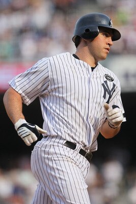 NEW YORK - AUGUST 09:  Mark Teixeira #25 of the New York Yankees rounds the bases after hitting a home run in the 8th inning against the Boston Red Sox during their game on August 9, 2010 at Yankee Stadium in the Bronx borough of New York City.  (Photo by