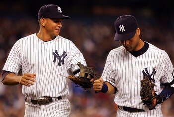 NEW YORK - SEPTEMBER 19: Alex Rodriguez #13 (L) and Derek Jeter #2 of the New York Yankees celebrate an inning double play against the Baltimore Orioles during their game at Yankee Stadium on September 19, 2007 in the Bronx borough of New York City.  (Pho